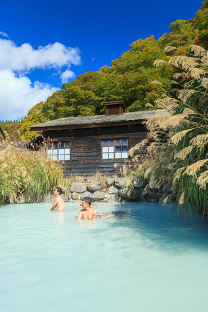 AKITA, JAPAN -OCT 20, 2012: People soaking in outdoor hot spring pool at Tsurunoyu onsen. Tsurunoyu Onsen is one of the oldest hot spring resorts of Nyutou Onsenkyo with a history of over 300 yearsのeditorial素材