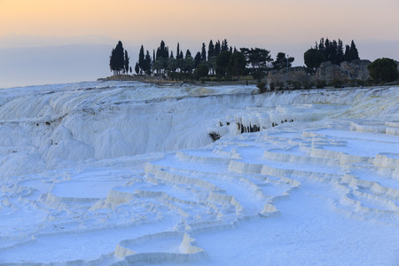 Dried Travertine pools and terraces in evening at Pamukkale, Denizli, Turkey.の写真素材