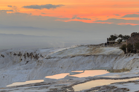 Sunset at Pamukkale with its travertine pools and terraces as foreground, Denizli, Turkey.の写真素材