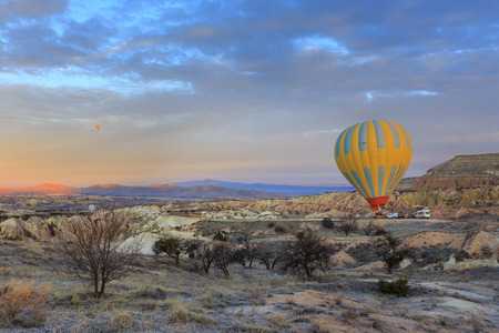 GOREME, TURKEY -JAN 30, 2013: Hot air balloon preparing to fly over Cappadocia, Goreme, Central Anatolia, Turkey. Hot-air ballooning is very popular tourist activity in Cappadocia.のeditorial素材
