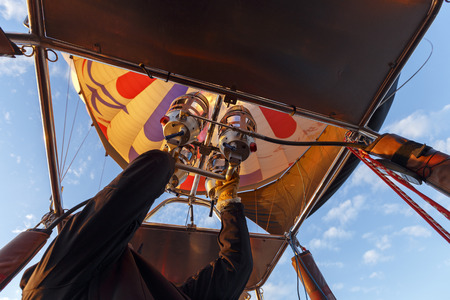 GOREME, TURKEY -JAN 30, 2013: Hot air balloon crew checking gas fire burner before fly over Cappadocia, Central Anatolia, Turkey. Hot-air ballooning is very popular tourist activity in Cappadocia.のeditorial素材
