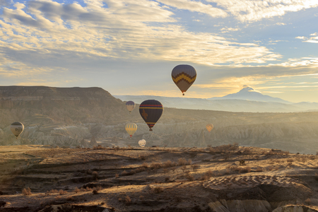 GOREME, TURKEY -JAN 30, 2013: Colorful Hot air balloons fly over Cappadocia, Goreme, Central Anatolia, Turkey. Hot-air ballooning is very popular tourist activity in Cappadocia.のeditorial素材