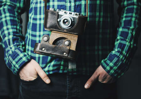 man with retro cameraの写真素材