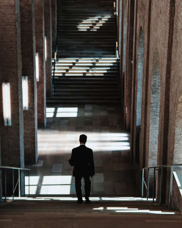 man coming down the high stairs in old house