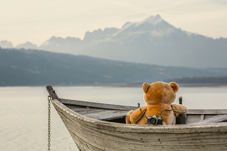 Teddybear sitting on the boat. Concept of lifeの写真素材