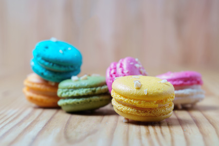 French yellow macarons on a wood backgroundの写真素材
