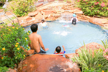 People swimming in the poolの写真素材
