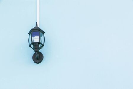 Lamp and light blue cement wallの写真素材
