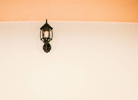 Wall lamp and white orange backgroundの写真素材