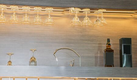 Blurred images of glasses and bottles in the barの写真素材