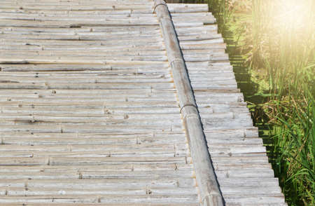 Wood plank texture and green grass background