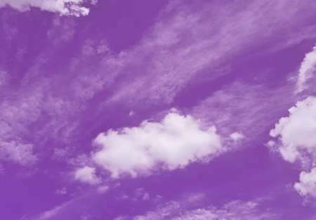 Purple sky and white cloudsの写真素材
