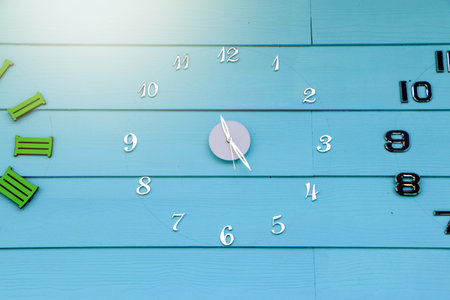 Blue wooden floor wall clock and decorative lampの写真素材