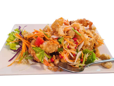 Spicy mixed seafood spicy salad dishes on isolated white background.の写真素材