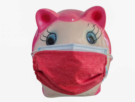 The pink pig wearing a double face mask on a isolated white backgroundの写真素材