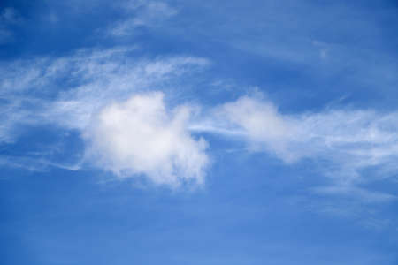 The blue sky and white clouds floated like cotton wool.
