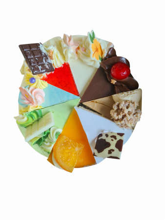 Cake combines delicious multi-colored toppings on isolated white background.の写真素材