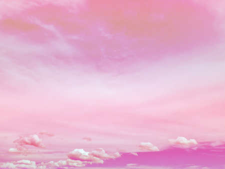 Pink sky and small clouds below. sweet pink background conceptの写真素材
