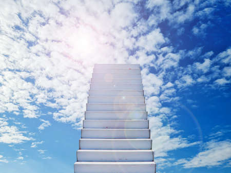 The stairs reach the white clouds in the blue sky. The Parable of Motivation Surreal dream, challenging conceptの写真素材
