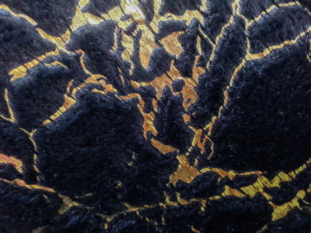 Close-up of black gold mohair for background.