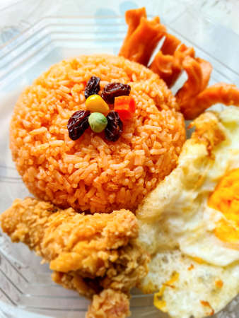 Thai style fried rice, fried chicken, sausage and fried egg. Fried rice tossed with sweet and sour...