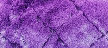 horizontal banner of a carpet with purple fur close-up. Design concept.Texture of a purple corner carpet.の写真素材