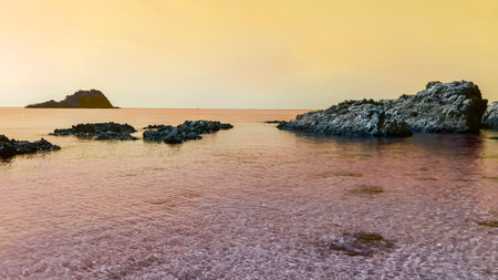 The sea and the yellow rocks in the quiet eveningの写真素材