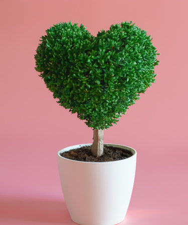 Heart tree in a white pot Put on a pastel pink floor, generative AIの素材