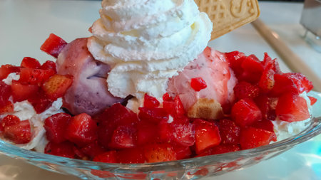 Ice cream and fresh strawberries Topped with whipped cream.の写真素材