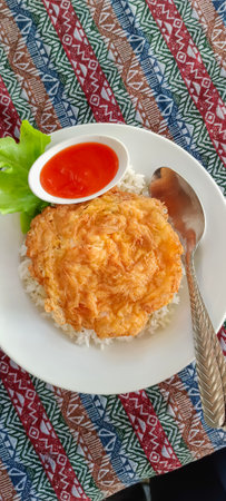 Delicious omelet rice and sauce. Vertical shot.の写真素材