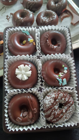 Mini donuts covered in chocolate, beautifully decorated and delicious.の写真素材