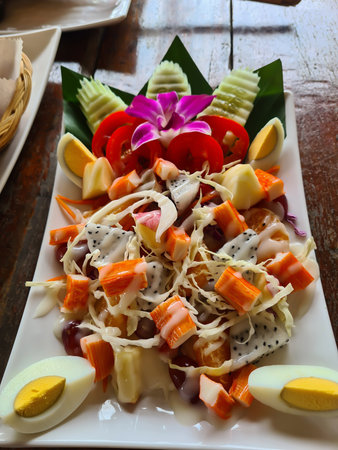 A vibrant medley of fresh vegetables, featuring a colorful assortment of tomatoes, cucumbers, and leafy greens, perfect for a healthy and delicious meal.の写真素材