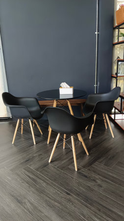 A set of black chairs in an empty cafeの写真素材