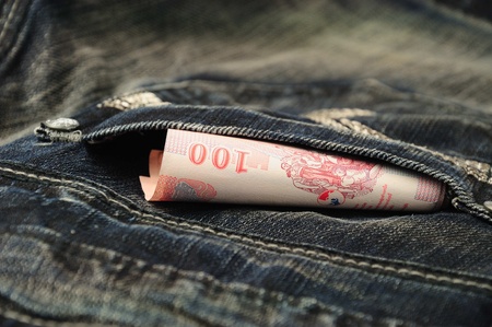100 baht bill in jean pocket,Thailand moneyの写真素材