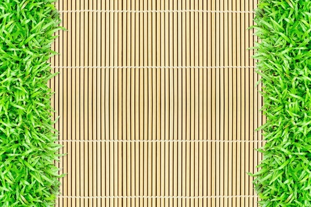 grass frame on bamboo background 