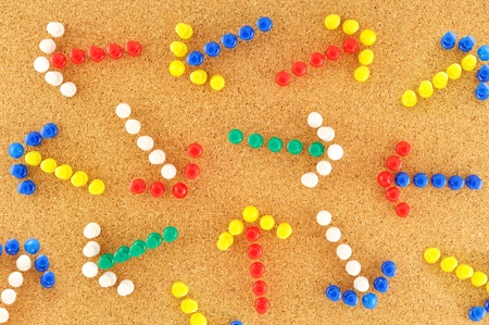 colorful arrows with random pined on cork boardの写真素材