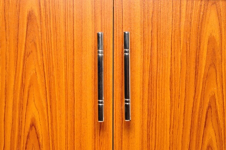 light brown doors with metal handlesの写真素材