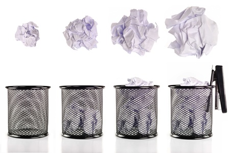 Trash can full of paper And collection of various ballsの写真素材