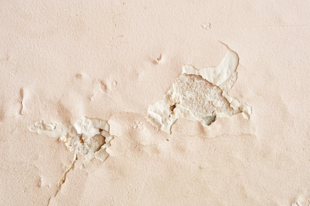 old paint and wall, cracked wall color pinkの写真素材