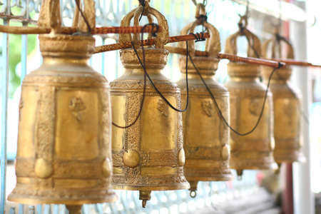 The line of thai style old gold bell. In perspective.の写真素材