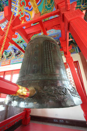 A old black bell in chinese temple, thailand.の写真素材