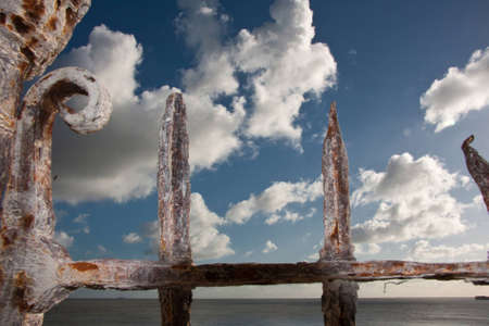 photograph taken to the sky from behind an old gateのeditorial素材