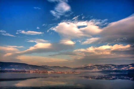 HDR landscape photographed during winter from a riverbankの写真素材