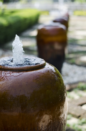 Jar Fountain in Gardenの写真素材