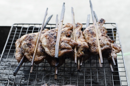 Roasting chicken on the stoveの写真素材