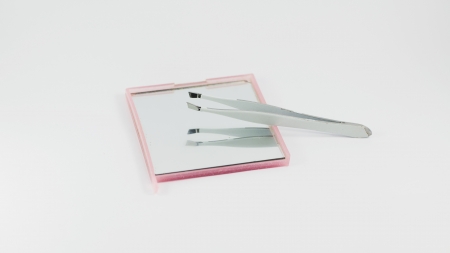 Tweezers with Mirror on Isolated backgroundの写真素材
