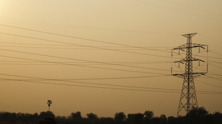 High-Voltage Tower orange Sky background 