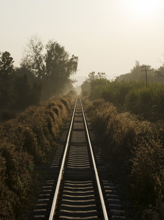 Railroad in the morning fog の写真素材