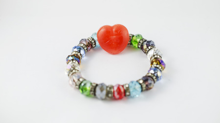 Bracelets with red heart islated on white background stock photoの写真素材
