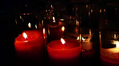 Candle lights in shadow backgroundの写真素材